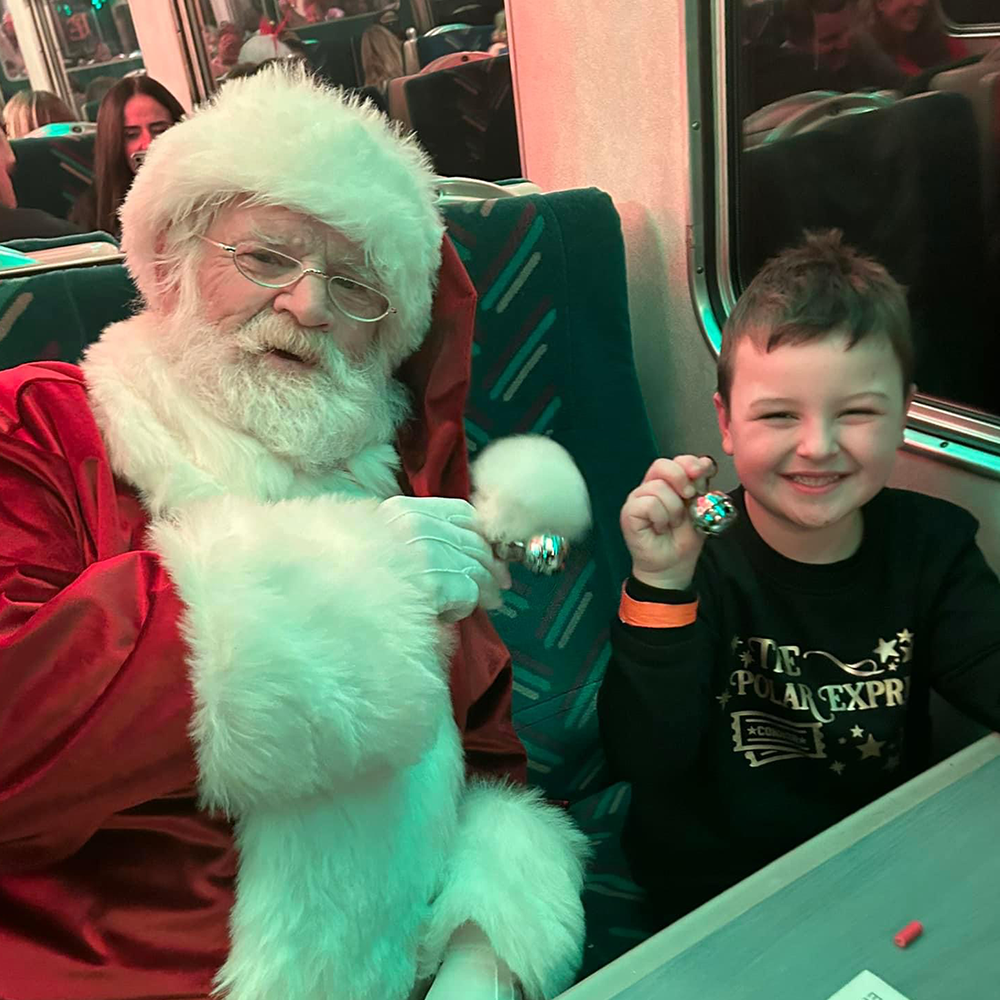 Santa meeting guests on board THE POLAR EXPRESS™ Train Ride 